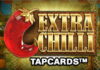 Stor röd chilifrukt och texten "EXTRA CHILLI TAPCARDS" mot en färgstark marknadsbakgrund.